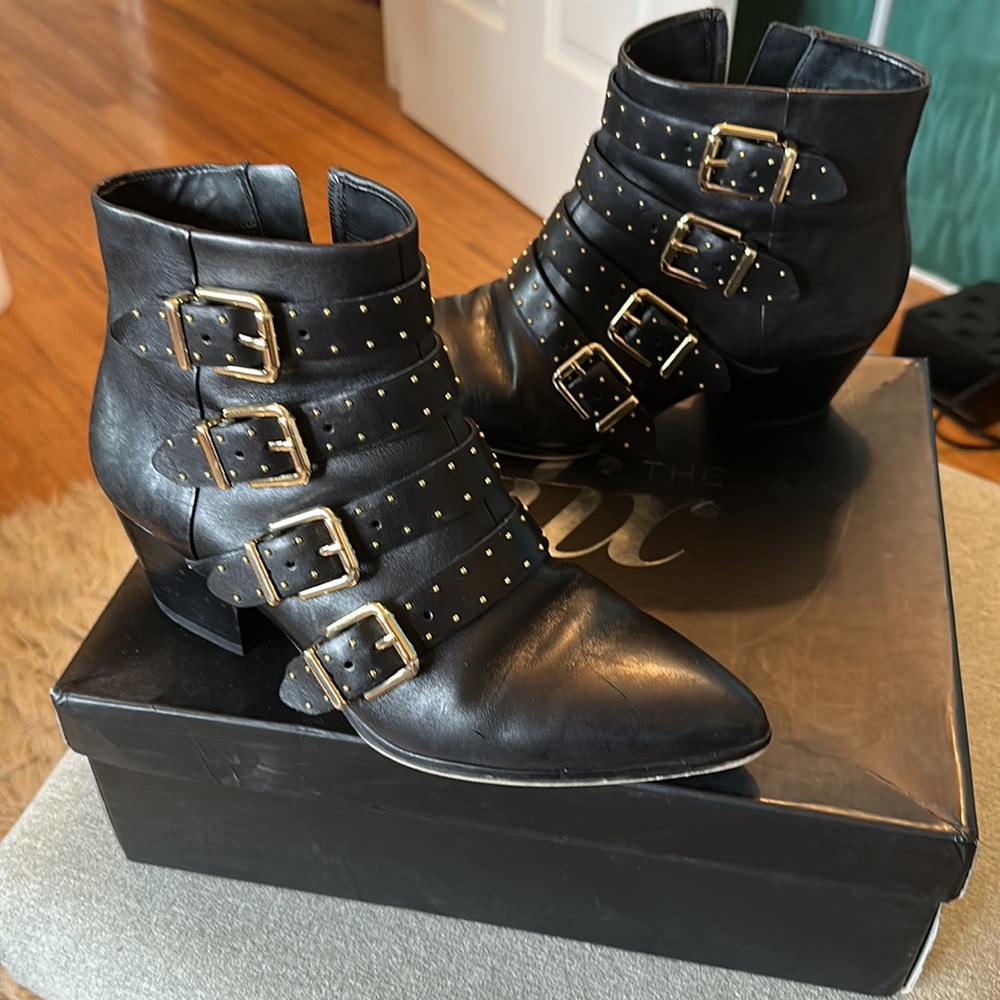 Gold buckle black leather ankle boots by The Fix